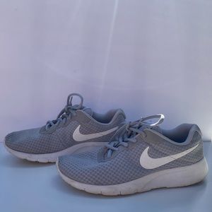 Gray Nike tennis shoes